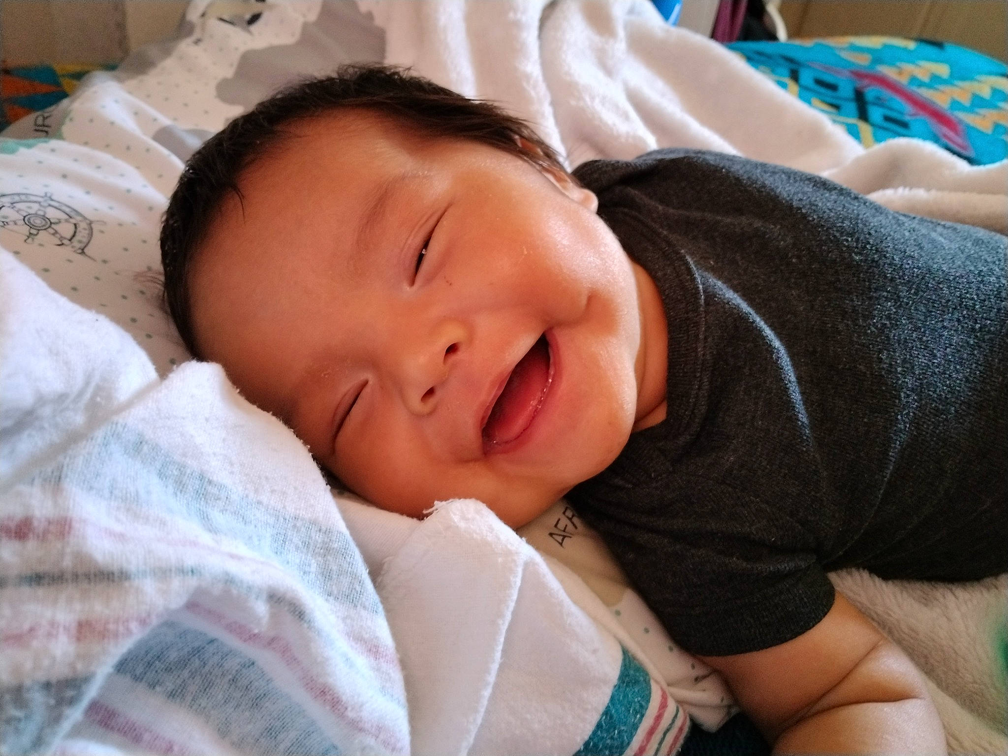 Khalil joined the competition — help win amazing prizes! baby, baby_toddler_clothing, bedtime, cheek, child, chin, comfort, event, eyelash, grass, happy, hat, linens, nap, nose, person, portrait_photography, skin, sleep, smile