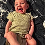 Reagan joined the competition — help win amazing prizes! baby, infant, smiling, laughing, onesie, green_clothing, lying_down, happy, cute, child, skin, face, foot, hand, blanket, marble_pattern, indoors, portrait, young, person