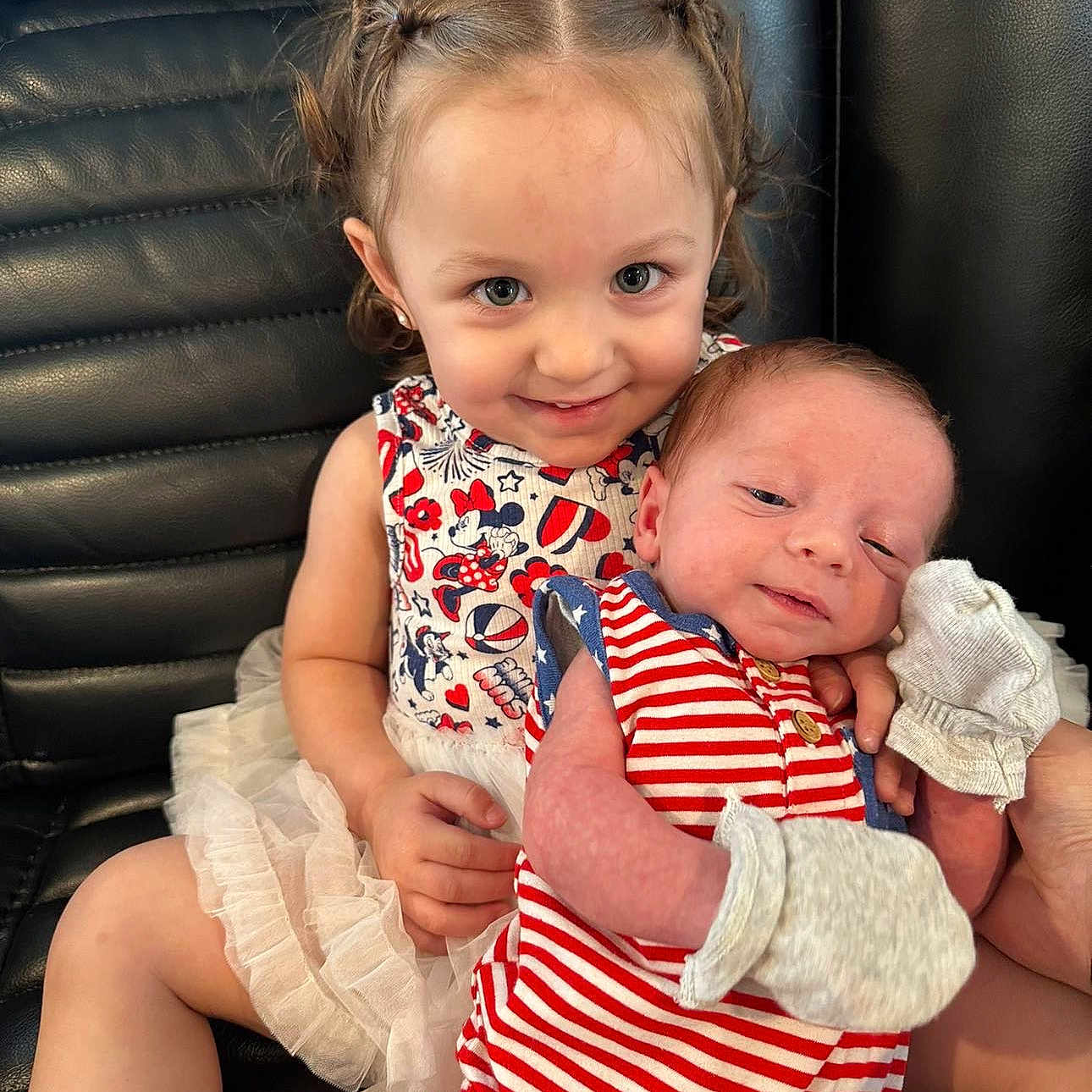 Asher joined the competition — help win amazing prizes! baby, black, braids, child, couch, cute, dress, family, happy, holding, indoor, leather, mittens, newborn, person, portrait, sibling, smile, striped_clothing, toddler