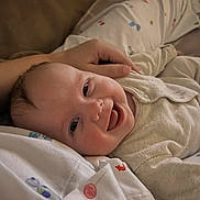 Florence joined the competition — help win amazing prizes! baby, smiling, infant, clothing, hand, face, lying_down, happy, cute, child, person, bed, fabric, soft, morning, skin, portrait, comfort, indoors, closeup