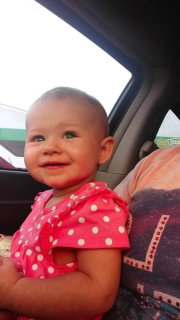 Aleigha joined the competition — help win amazing prizes! baby, beauty, car, car_seat, cheek, child, design, face, fun, head, joy, lip, neck, pattern, person, pink, sitting, skin, smile, toddler