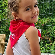 Elaia a rejoint le concours — aidez-le/la à gagner de superbes lots ! casual_clothing, child, daylight, earrings, fence, garden, girl, grass, greenery, happy, nature, outdoor, person, playful, portrait, red_scarf, smile, standing, white_clothing, young
