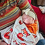 Lilith joined the competition — help win amazing prizes! baby, sleeping, blanket, fox_pattern, headband, striped_shirt, person, hand, indoor, cozy, red_chair, fabric, comfort, cute, peaceful, child, newborn, apparel, rest, home