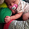 Willow joined the competition — help win amazing prizes! baby, sleeping, pacifier, headband, bow, infant, cushion, pink, green, patterned_clothing, soft_toys, cozy, child, cute, resting, indoors, portrait, peaceful, small_hands, newborn