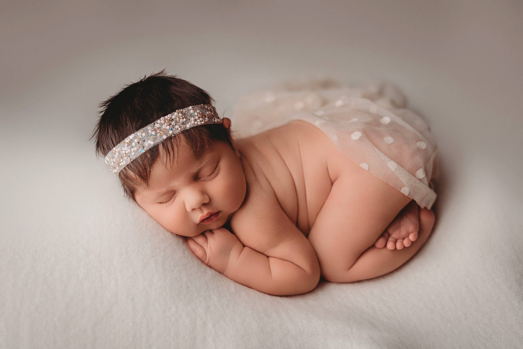 Acadia is registered to the contest to win money with this photo: baby, baby_sleeping, baby_toddler_clothing, cap, comfort, eye, eyebrow, fashion_accessory, finger, flash_photography, flooring, foot, grass, happy, headband, headpiece, iris, nail, person, toddler