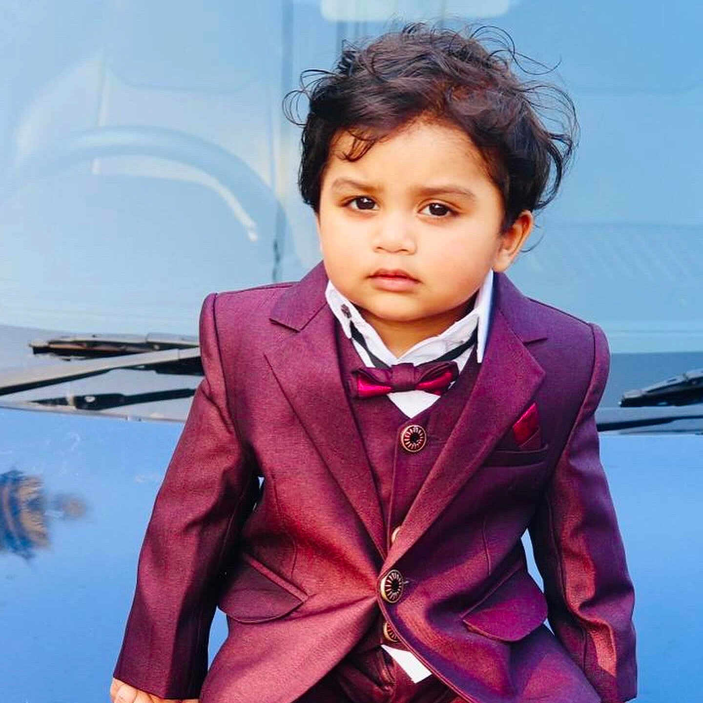 Juan is registered to the contest to win money with this photo: accessories, blackhair, blazer, boy, child, clothing, coat, curlyhair, face, formalwear, hair, head, jacket, male, person, photography, portrait, sleeve, suit, tie