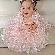Giulia participe au concours pour gagner de l'argent avec cette photo : baby, child, dress, pink, butterflies, headband, smiling, happy, sitting, couch, leather, cute, toddler, portrait, indoor, hands, furniture, fashion, girl, person