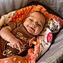baby, infant, newborn, smile, face, eyes, hand, onesie, pacifier, blanket, plush_blanket, soft_texture, cozy, bedding, seat, clothing, cheek, portrait, soft_light, happy