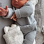Marty is registered to the contest to win money with this photo: baby, bed, bedroom, blanket, bodypart, clothing, cushion, face, finger, furniture, hand, head, homedecor, knitwear, newborn, person, photography, portrait, sleeping, sweater