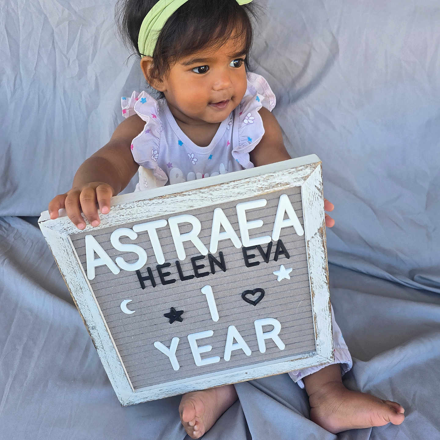 Astraea is registered to the contest to win money with this photo: accessories, bodypart, child, couch, cushion, face, female, finger, furniture, girl, hand, head, homedecor, number, person, photography, portrait, sitting, symbol, text