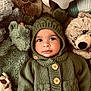 Oliver is registered to the contest to win money with this photo: adorable, baby, buttoned_sweater, child, closeup, cozy, cute, eyes, face, green, indoor, infant, knitwear, laying_down, plush_toys, pom_poms, portrait, soft_texture, stuffed_animals, warm_clothing