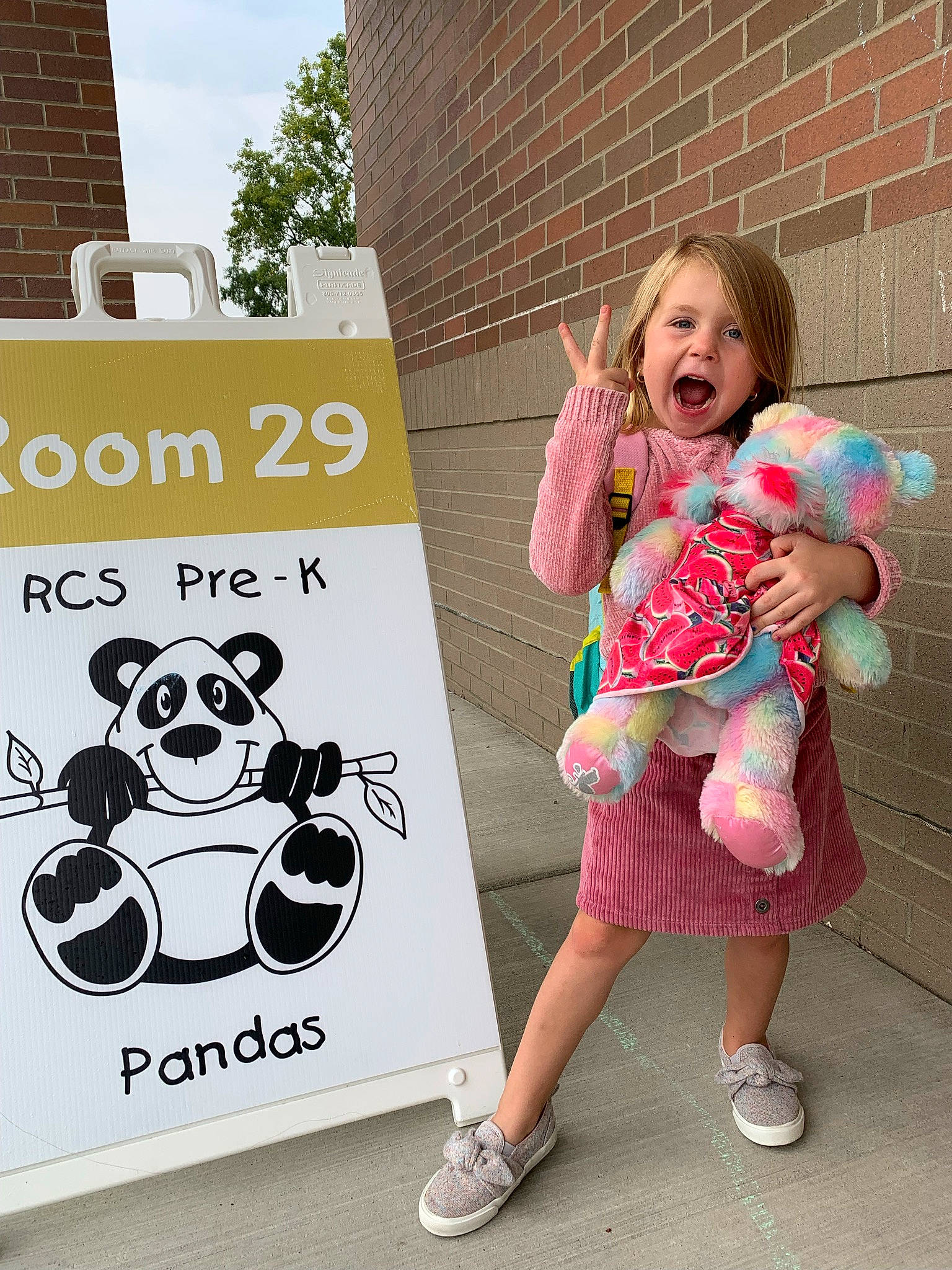 Carlie joined the competition — help win amazing prizes! advertising, brick, brickwork, child, eyewear, flip_flops, font, happy, leisure, magenta, motor_vehicle, panda, pattern, person, pink, recreation, sandal, sign, signage, skull