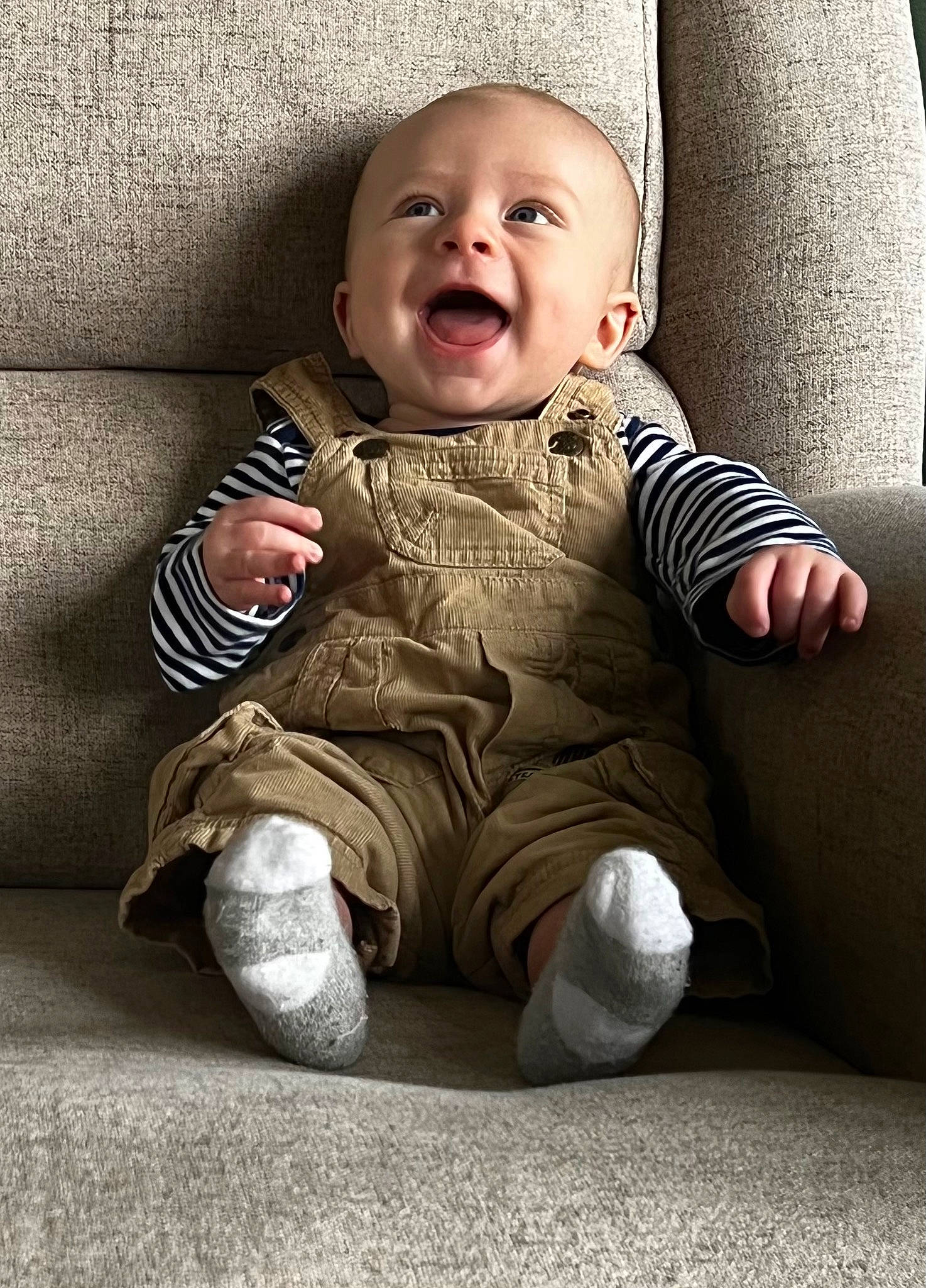 Thomas is registered to the contest to win money with this photo: baby, baby_toddler_clothing, cheek, child, comfort, eye, facial_expression, flash_photography, flooring, happy, head, human_body, lip, nose, person, sitting, skin, sleeve, smile, toddler