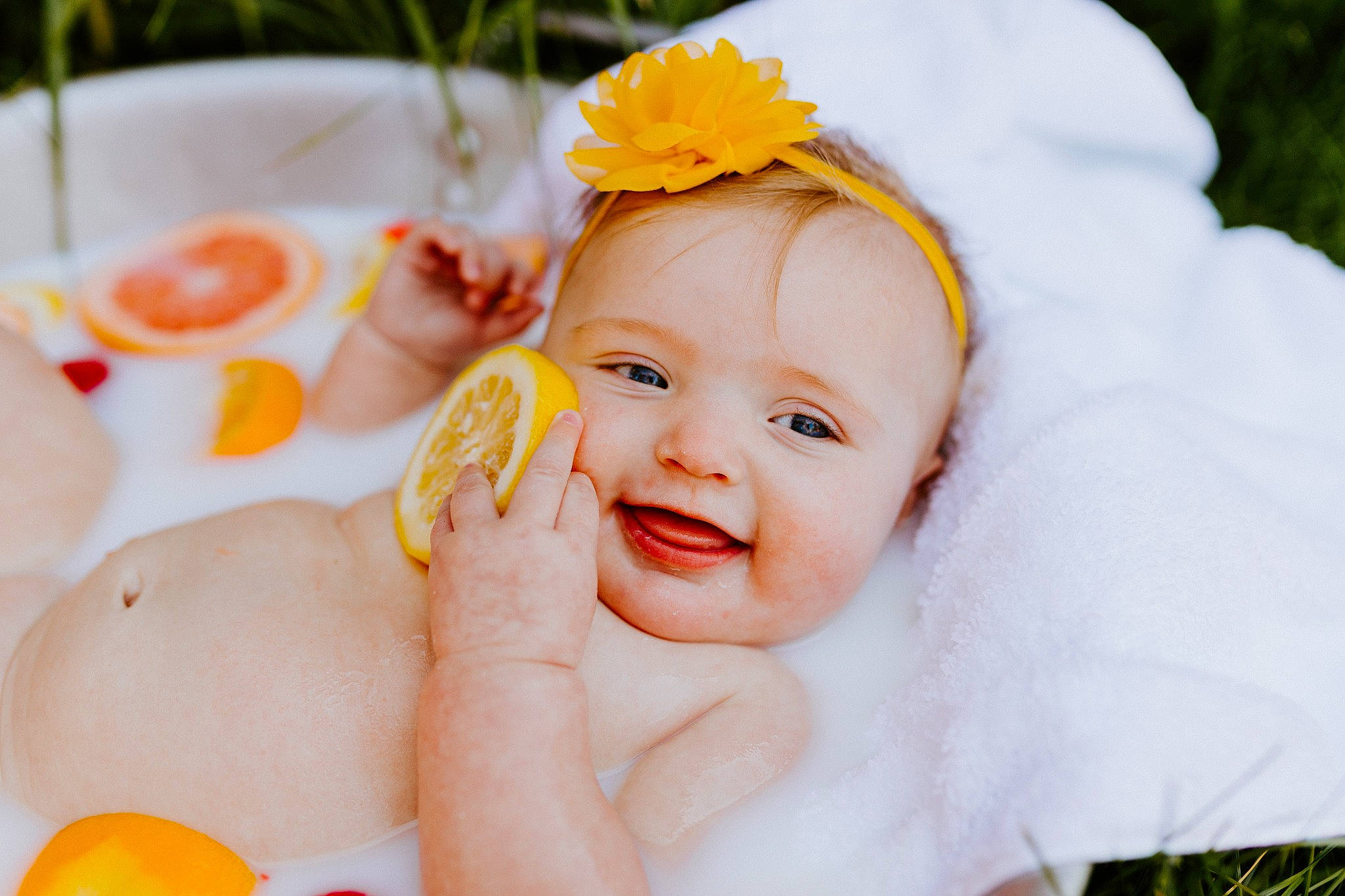 Willow joined the competition — help win amazing prizes! baby, baby_toddler_clothing, eye, face, finger, flower, gesture, hand, happy, head, headgear, headpiece, iris, joy, orange, person, plant, skin, smile, toddler