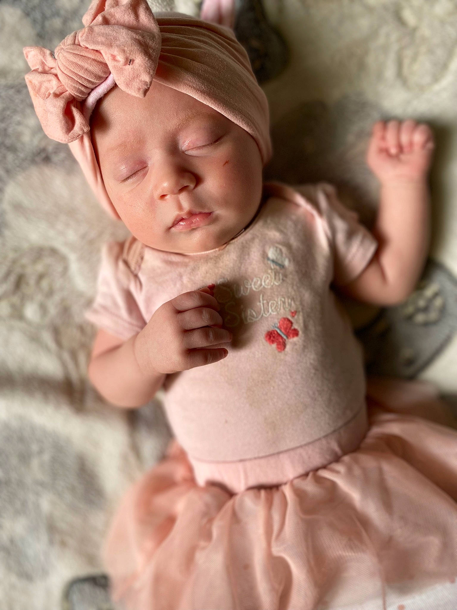 Elizah is registered to the contest to win money with this photo: arm, baby, baby_toddler_clothing, cheek, child, dress, fashion_accessory, fawn, fur, gesture, happy, linens, neck, peach, person, pink, skin, sleeve, toddler, toy