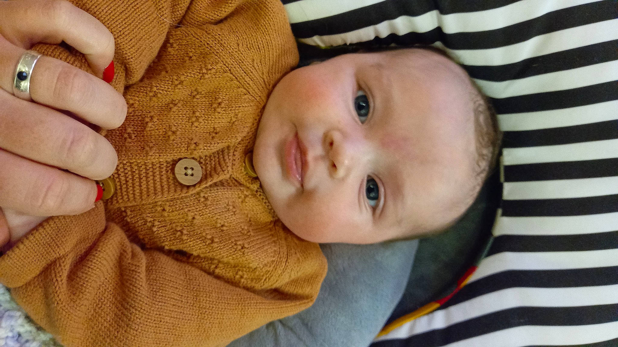 Emmie participe au concours pour gagner de l'argent avec cette photo : baby, baby_products, baby_toddler_clothing, cheek, child, chin, comfort, eyelash, gesture, iris, lip, nail, nose, pattern, person, skin, sleeve, thumb, toddler, wood