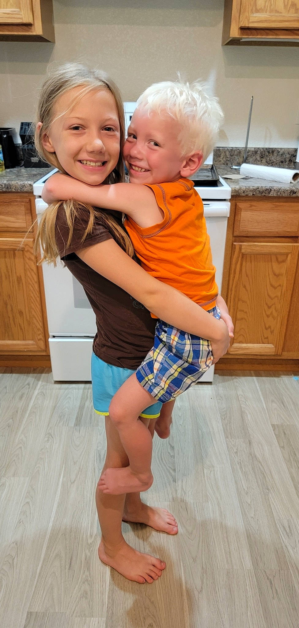 Taylor is registered to the contest to win money with this photo: cabinetry, eye, face, floor, flooring, fun, hairstyle, happy, head, human_body, joy, muscle, person, photograph, shoulder, skin, smile, standing, thigh, waist