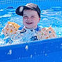 Link a rejoint le concours — aidez-le/la à gagner de superbes lots ! animal_print, blue, cap, child, clothing, floaties, fun, happy, laughing, outdoor, play, pool, safety, splashing, summer, sunlight, swimming, toddler, water, water_droplets