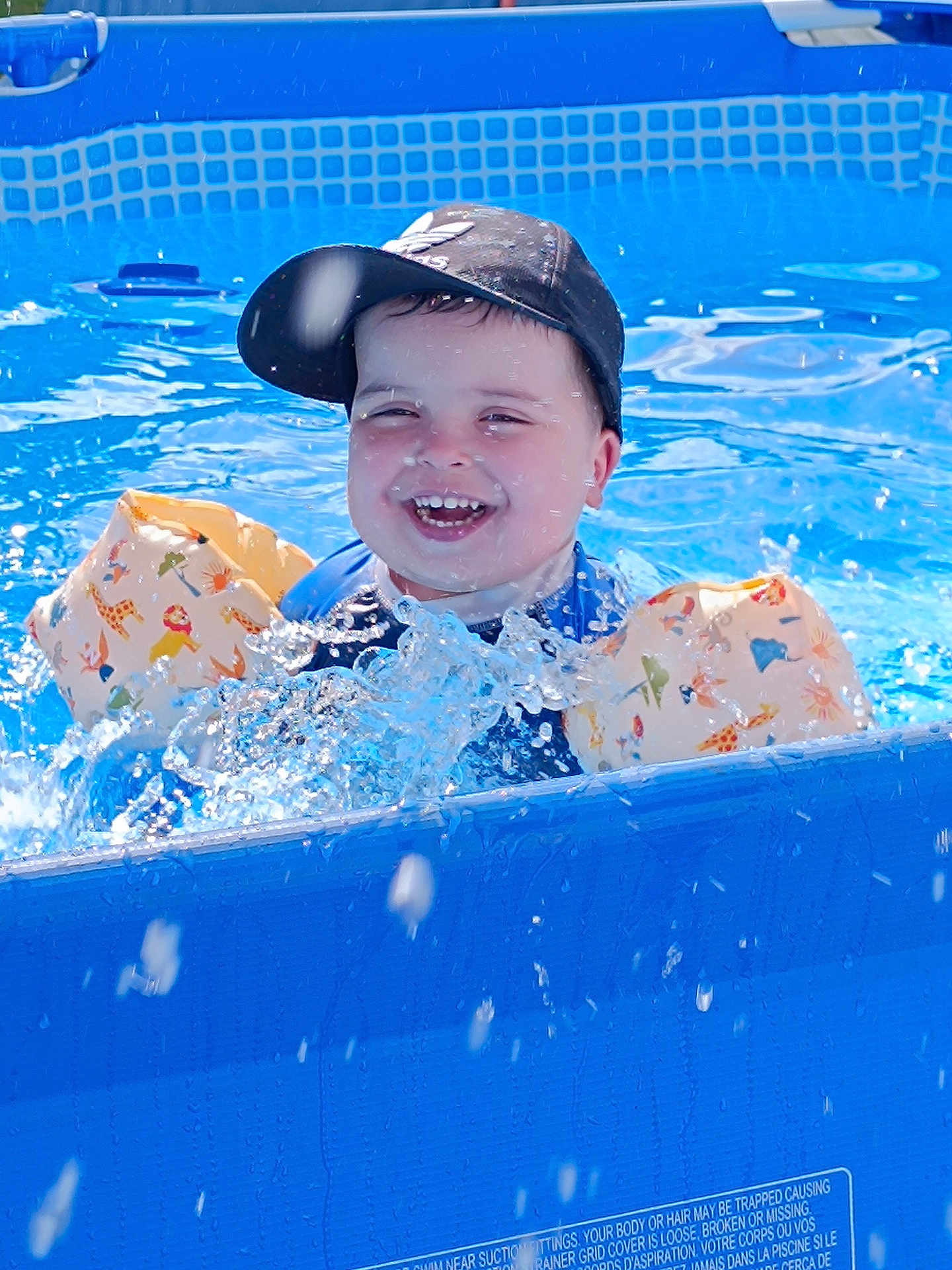 Link a rejoint le concours — aidez-le/la à gagner de superbes lots ! animal_print, blue, cap, child, clothing, floaties, fun, happy, laughing, outdoor, play, pool, safety, splashing, summer, sunlight, swimming, toddler, water, water_droplets