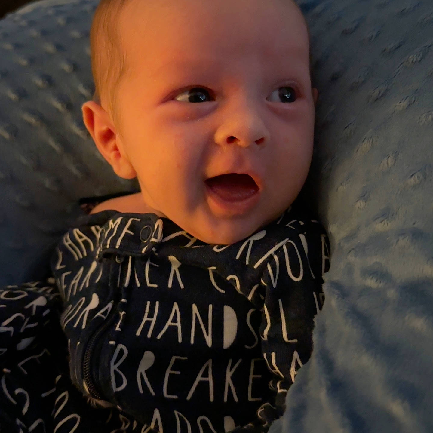 Eli is registered to the contest to win money with this photo: baby, baby_laughing, baby_toddler_clothing, cheek, child, cloud, comfort, happy, iris, lip, mouth, nose, organ, outerwear, pattern, person, sleeve, smile, t_shirt, tints_and_shades