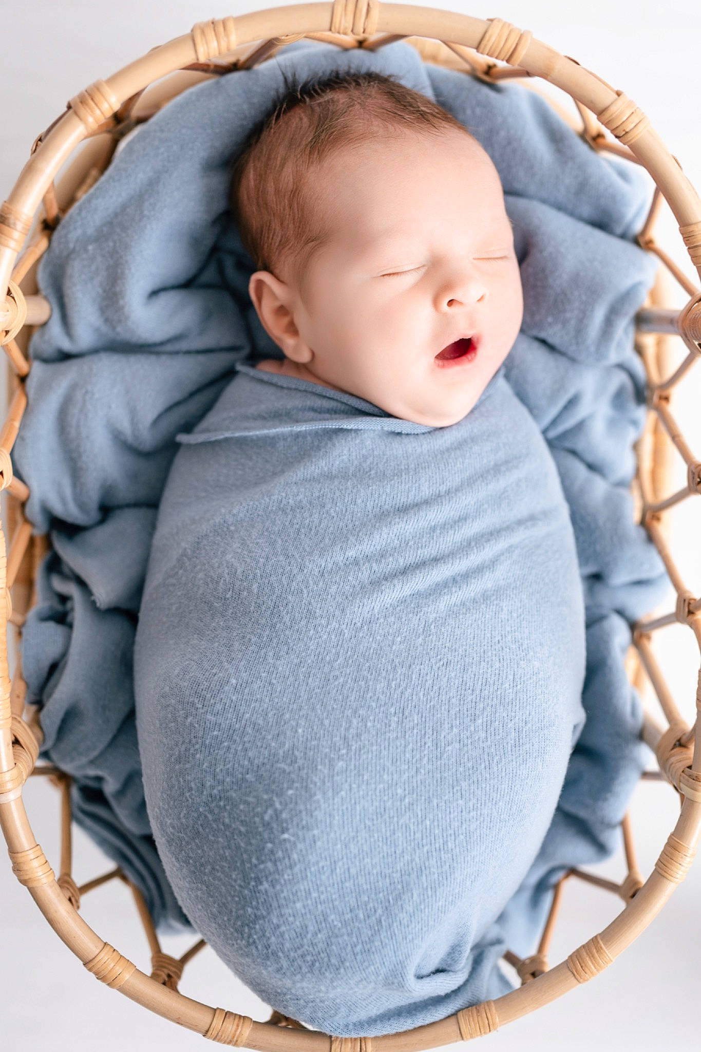 Eli is registered to the contest to win money with this photo: arm, baby, baby_products, baby_safety, baby_sleeping, baby_toddler_clothing, child, circle, collar, comfort, face, fashion_accessory, grey, head, linens, pattern, person, sitting, sleeve, textile