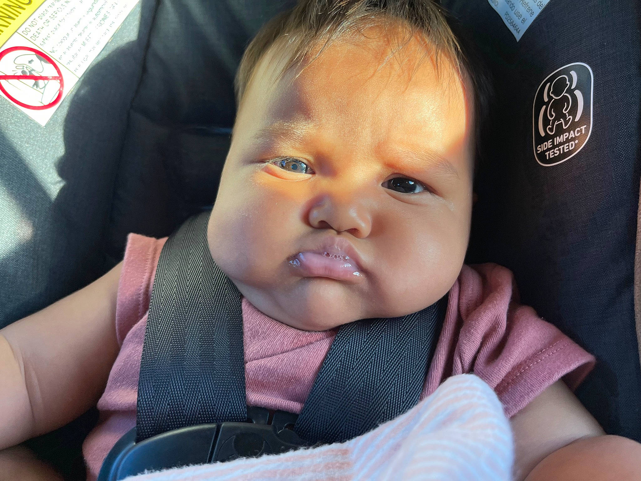 Kawailani is registered to the contest to win money with this photo: baby, baby_in_car_seat, baby_toddler_clothing, cheek, child, chin, comfort, ear, eyebrow, eyelash, facial_expression, finger, gesture, happy, iris, nose, outerwear, person, skin, thumb