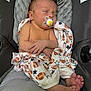 Oppie joined the competition — help win amazing prizes! baby, newborn, pacifier, blanket, football_pattern, star_pattern, sleeping, infant, cushion, car_seat, gray, wrapped, peaceful, cute, small_feet, hands, indoors, closeup, child, resting