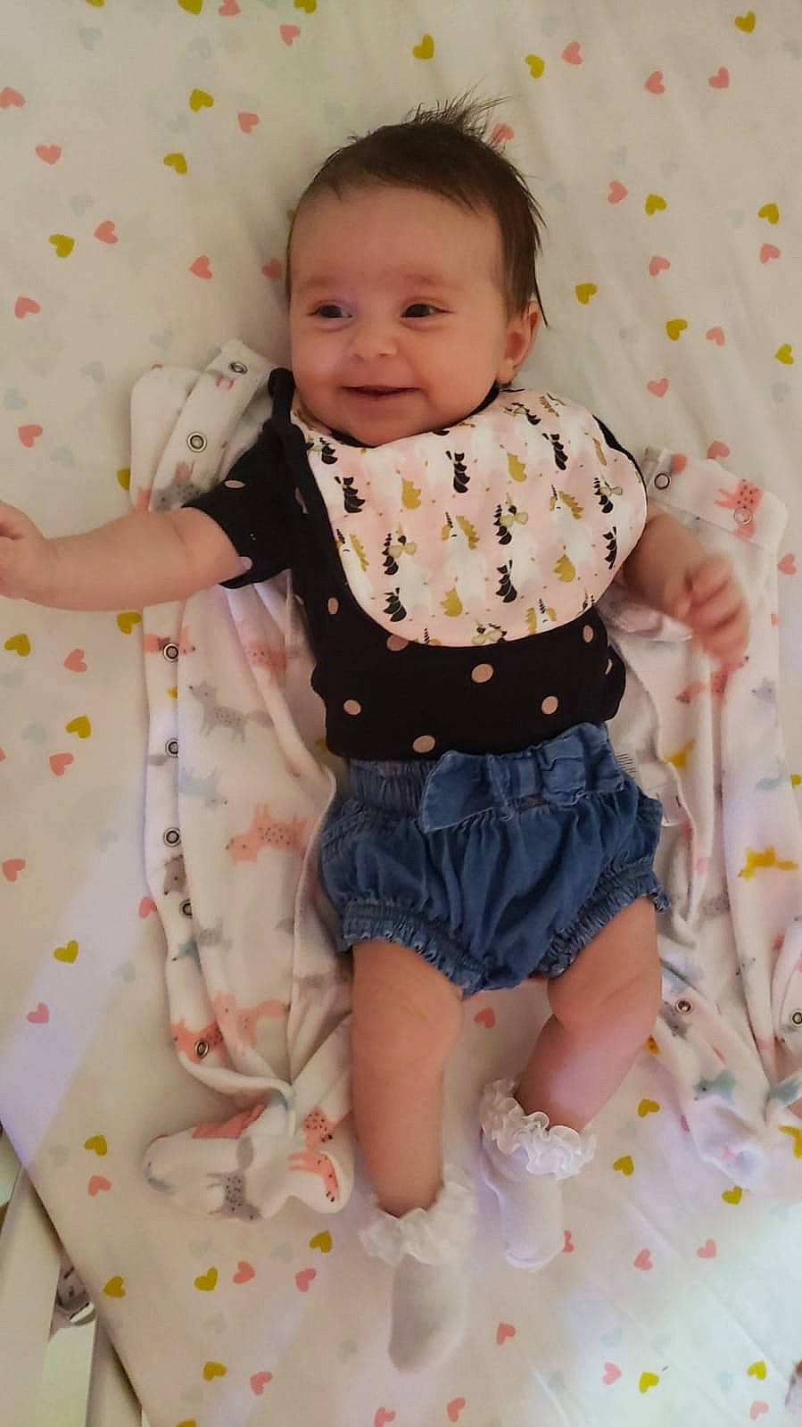 Amy is registered to the contest to win money with this photo: arm, baby, baby_toddler_clothing, child, collar, dress_shirt, face, facial_expression, happy, head, joy, pattern, person, pink, product, skin, sleeve, smile, t_shirt, textile