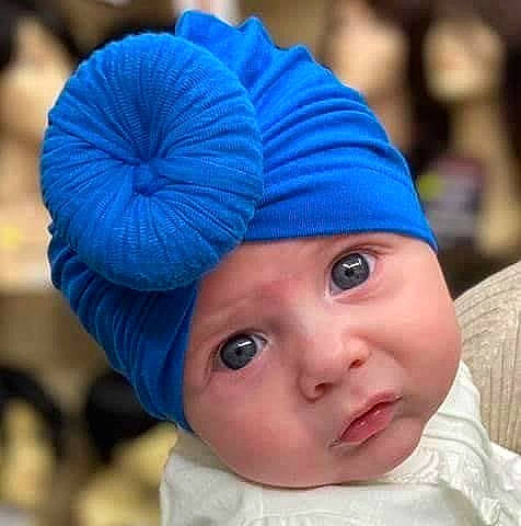 Lilianna is registered to the contest to win money with this photo: baby, beanie, bonnet, cap, child, clothing, ear, electric_blue, fashion_accessory, headgear, headwear, knit_cap, person, toddler