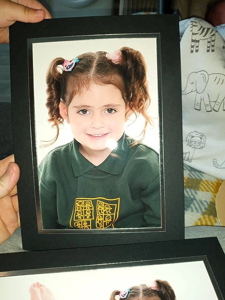 Alanna is registered to the contest to win money with this photo: art, child, hairstyle, interior_design, joy, person, picture_frame, snapshot