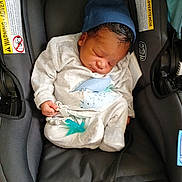 Tyon joined the competition — help win amazing prizes! baby, newborn, sleeping, car_seat, pacifier, hat, clothing, infant, cute, child, resting, black, grey, blue, dinosaur_print, indoors, seatbelt, soft, peaceful, small