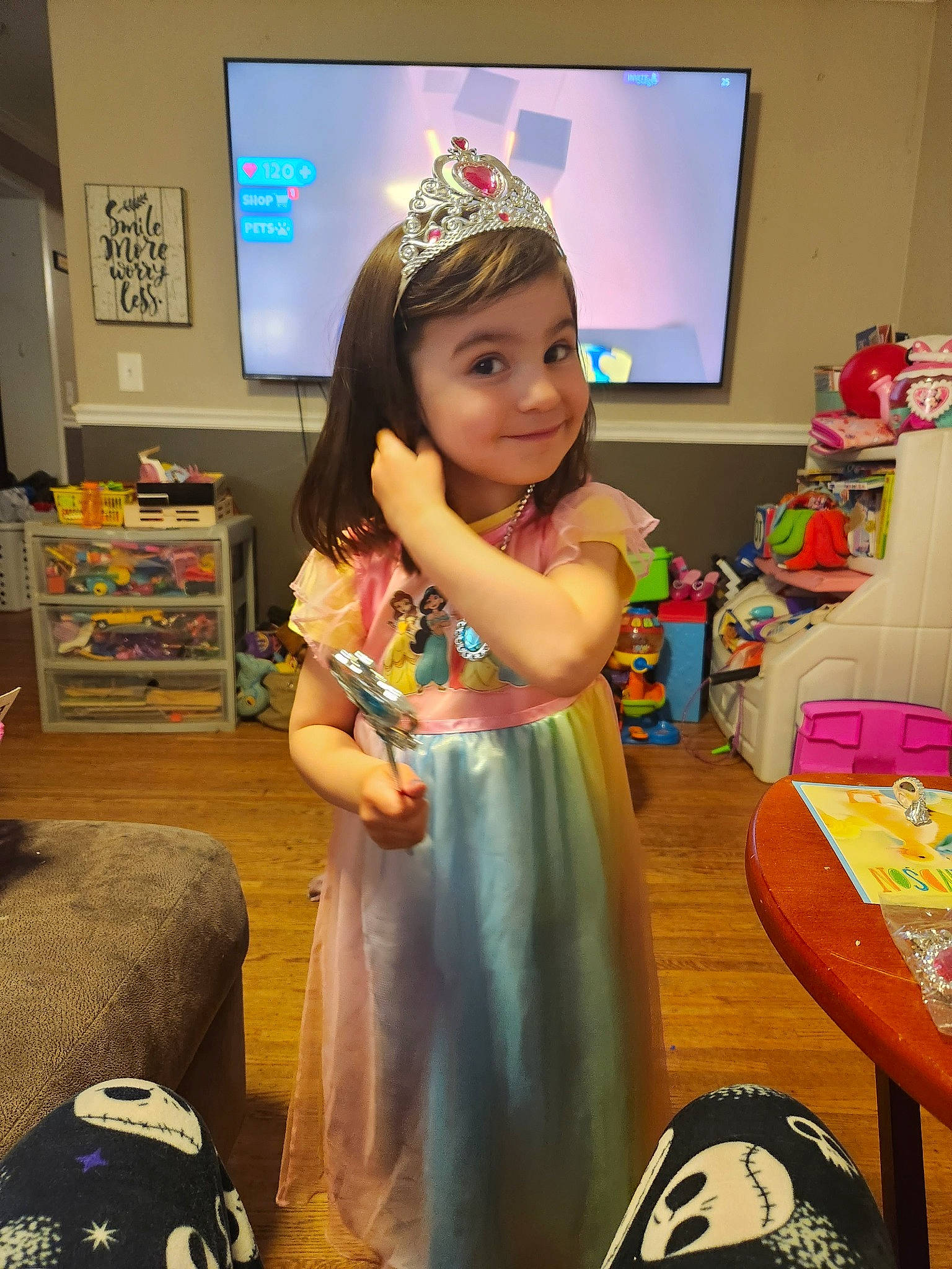 Lyla is registered to the contest to win money with this photo: chair, child, event, flooring, fun, happy, joy, party, person, play, room, shelf, smile, t_shirt, television, toddler