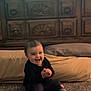 Zevaeh joined the competition — help win amazing prizes! baby, baby_clothes, black_clothing, carpet, child, clapping, cozy, cute, floor, furniture, happy, home, indoor, infant, pillow, portrait, sitting, smile, toddler, wooden_dresser