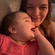 Zevaeh joined the competition — help win amazing prizes! adult, baby, child, closeup, couch, cozy, face, family, glasses, hair, hand, happy, indoor, pink_dress, polka_dots, portrait, relaxing, smiling, snuggling, woman