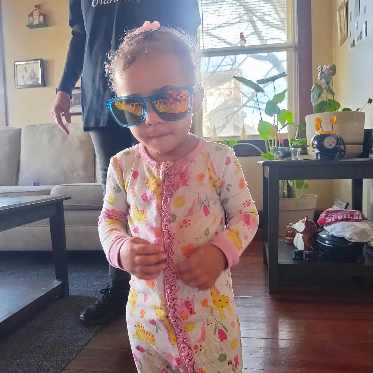 Rumanni joined the competition — help win amazing prizes! casual_clothing, child, cute, decor, family, floor, furniture, home, indoor, living_room, pajamas, person, plants, portrait, reflection, sunglasses, toddler, window, woman, wooden_floor