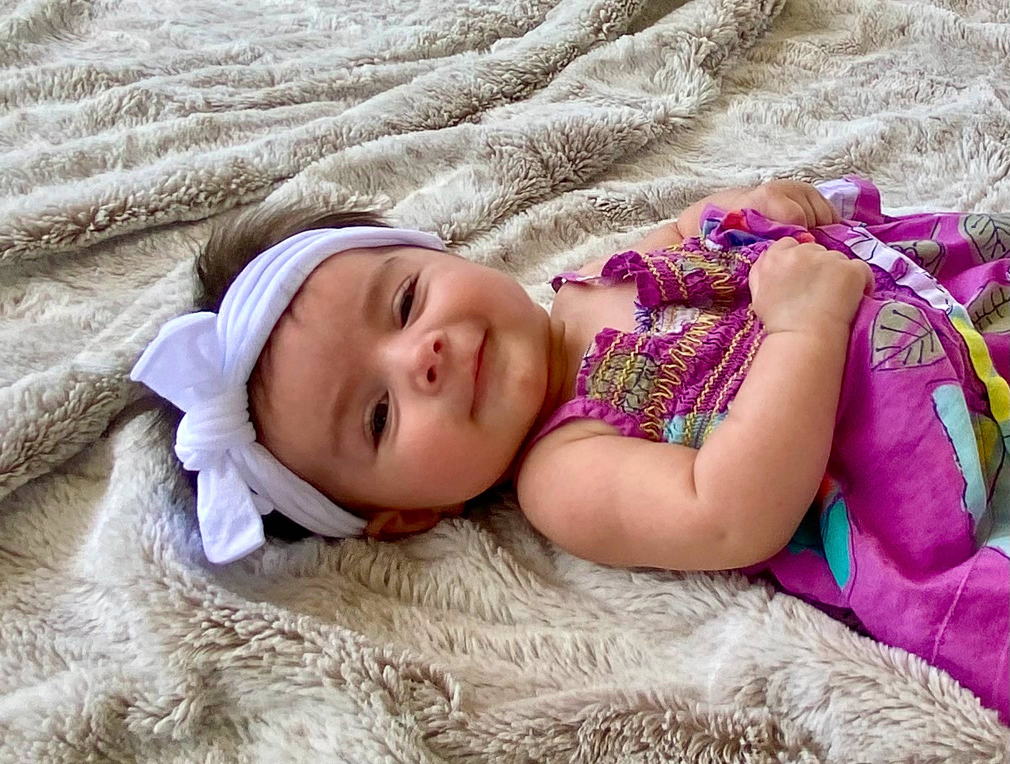 Reagan joined the competition — help win amazing prizes! bedding, bedtime, child, comfort, fashion_accessory, fur, grass, happy, headwear, linens, magenta, nap, pattern, person, plant, sitting, skin, smile, toddler, tree