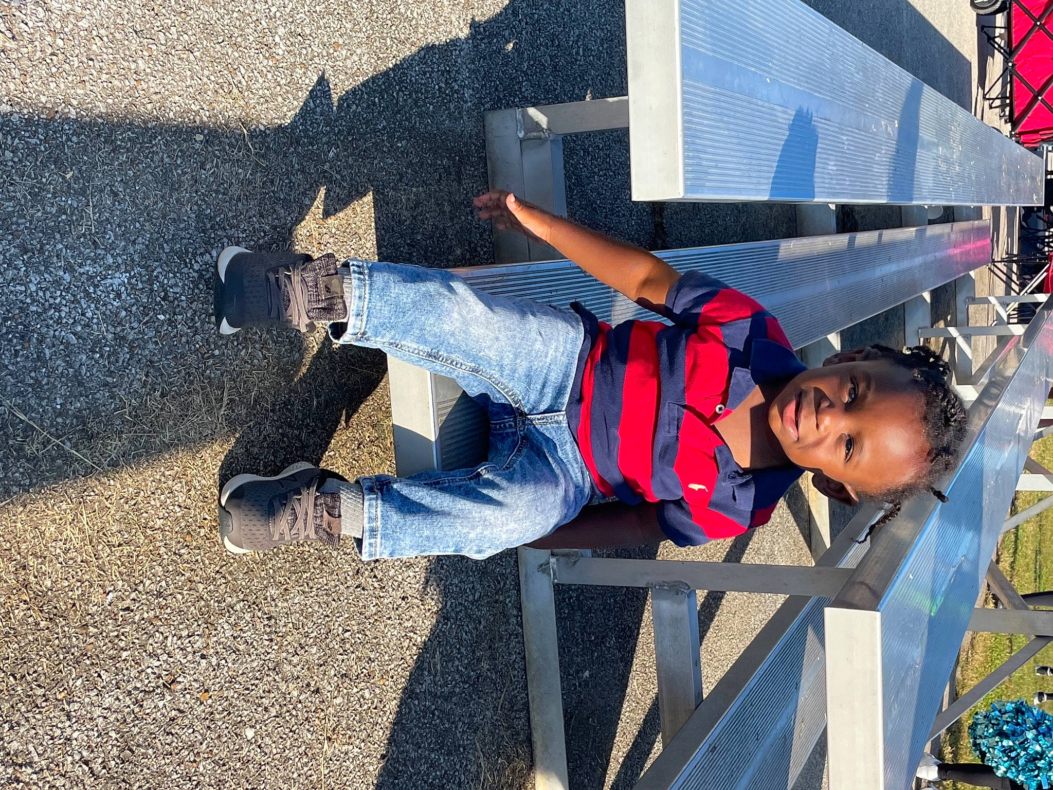 Ryan is registered to the contest to win money with this photo: asphalt, carmine, city, concrete, denim, electric_blue, fun, human_leg, leisure, outdoor_shoe, pedestrian, person, shadow, shoe, sitting, sneakers, street, street_fashion, travel, walking_shoe