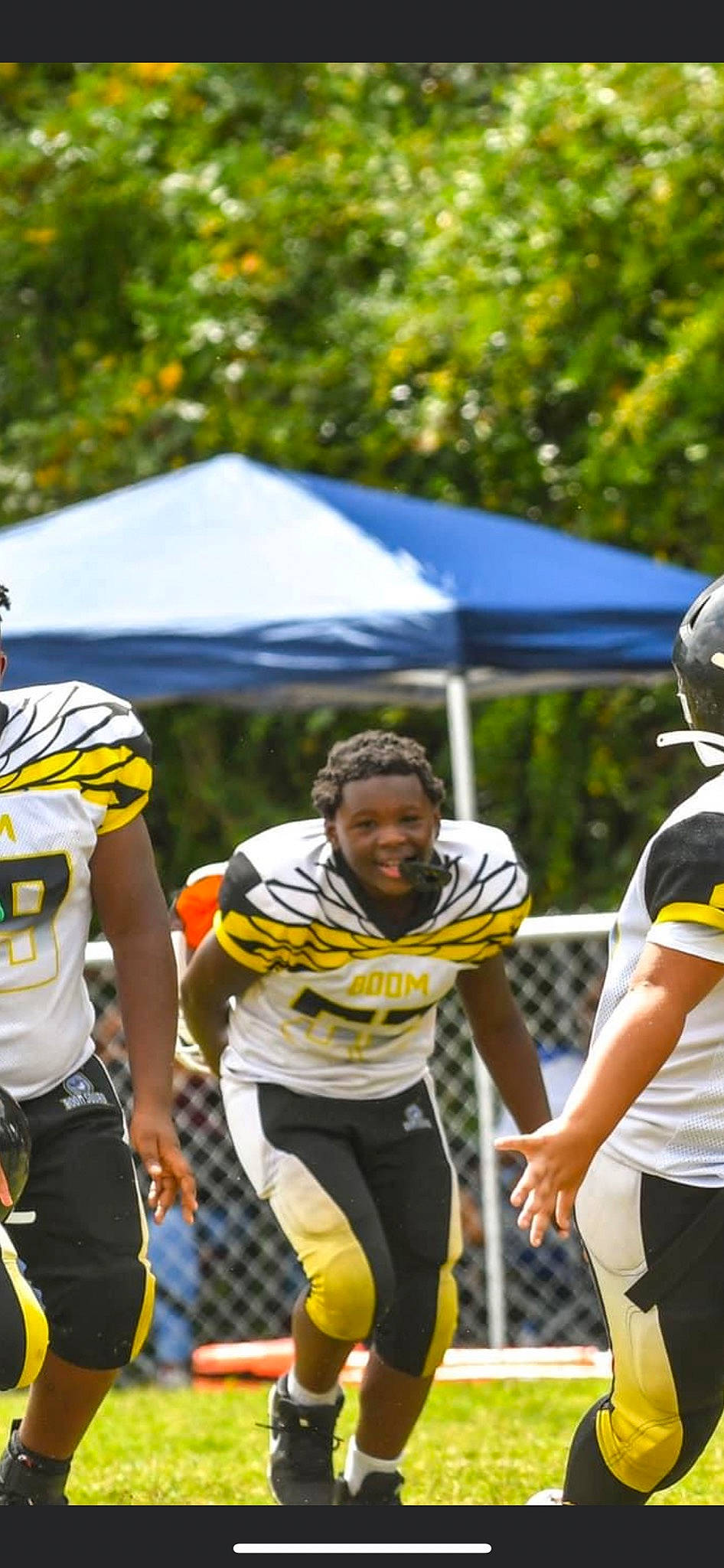 Tré joined the competition — help win amazing prizes! american_football, ball_game, canadian_football, face_mask, football_equipment, football_gear, grass, gridiron_football, helmet, jersey, person, player, shorts, sports, sports_equipment, sports_gear, sports_uniform, sportswear, thigh, tree