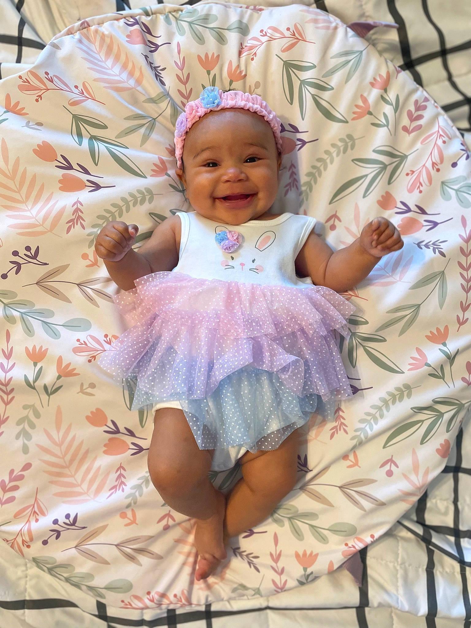 Kya joined the competition — help win amazing prizes! baby, baby_products, baby_toddler_clothing, cheek, child, comfort, embellishment, fashion_accessory, fun, happy, headwear, joy, linens, magenta, pattern, person, pink, purple, sitting, skin