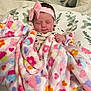 baby, blanket, bow, child, cute, face, floral_pattern, headband, infant, pillow, pink, resting, sleeping, soft, toddler, wrapped, young_child, heart_pattern, colorful, cozy