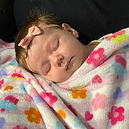 Ruby joined the competition — help win amazing prizes! baby, blanket, bow, calm, cheek, closed_eyes, cozy, cute, floral_pattern, headband, indoor, infant, newborn, peaceful, pink, plush_blanket, portrait, sleep, sleeping_baby, soft_texture