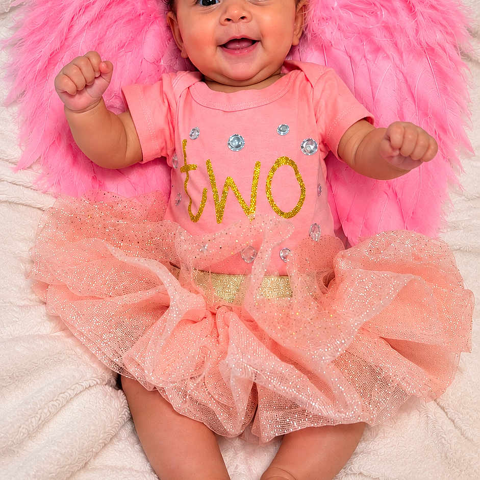Eliyah'Ann joined the competition — help win amazing prizes! baby, child, infant, smiling, portrait, pink, fairy_wings, bow, headband, tutu, dress, sparkles, blanket, lying_down, indoor, baby_fashion, curly_hair, bare_feet, celebration, cute