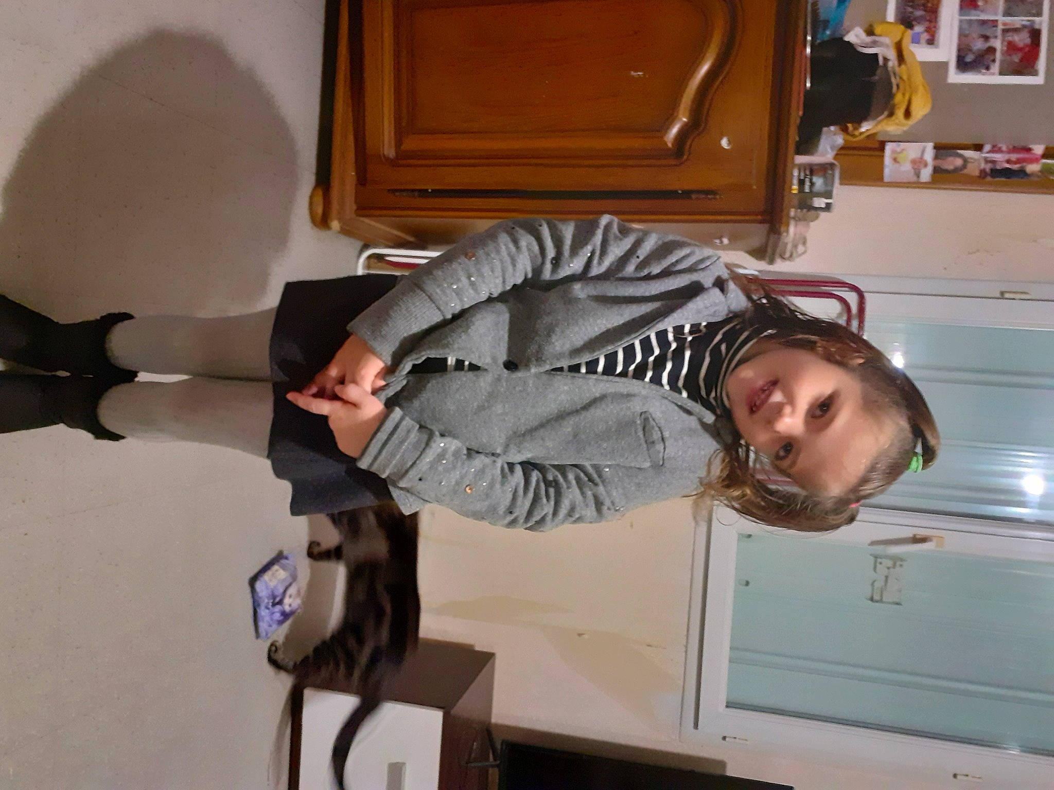 Elena participe au concours pour gagner de l'argent avec cette photo : cabinetry, comfort, dress_shirt, elbow, flooring, fur, gesture, kitchen, person, room, shelf, smile, suit, tie, white_collar_worker, wood, wrist