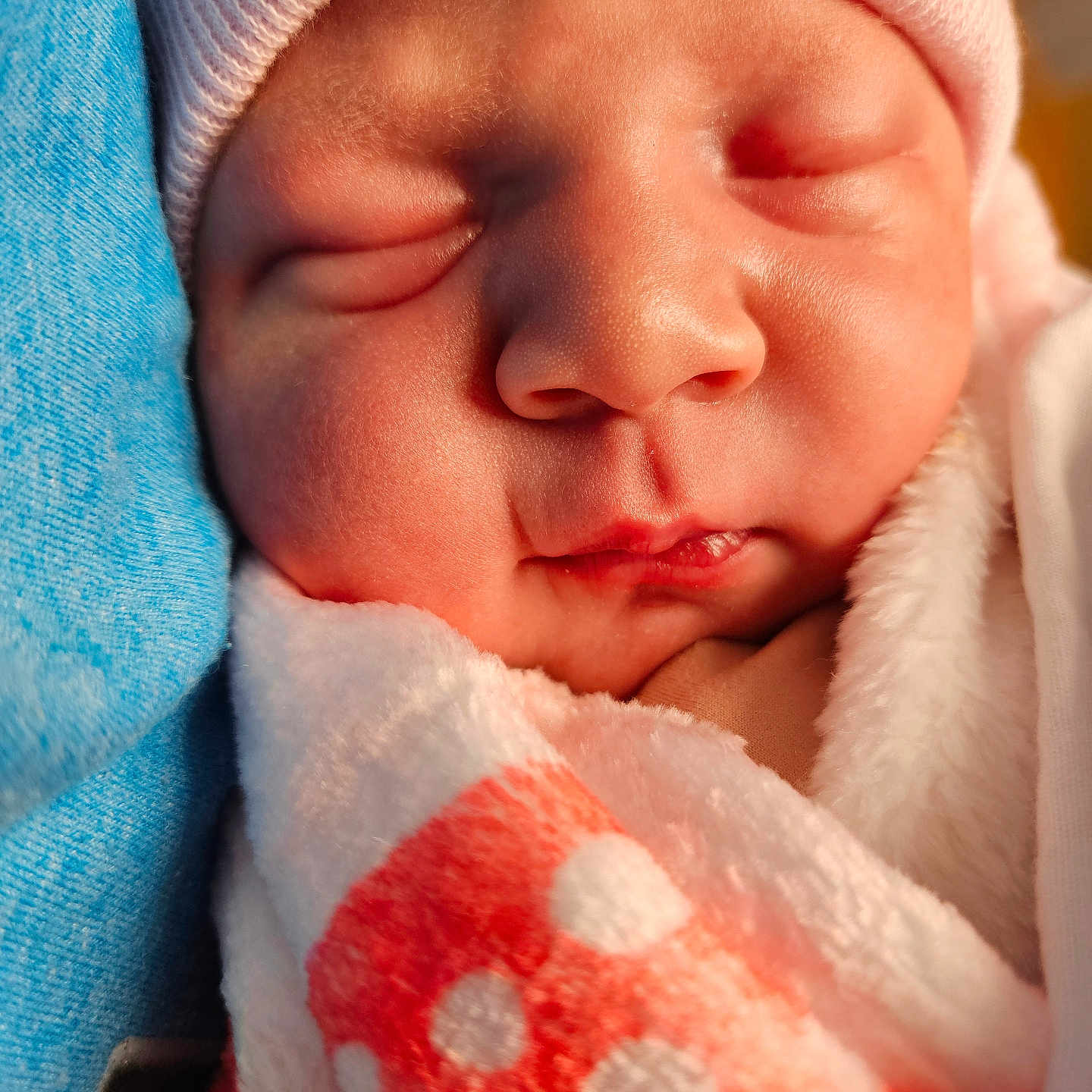Londyn joined the competition — help win amazing prizes! baby, beanie, blanket, bonnet, cap, clothing, face, glove, hat, head, newborn, person, photography, portrait, quilt, sleeping, towel
