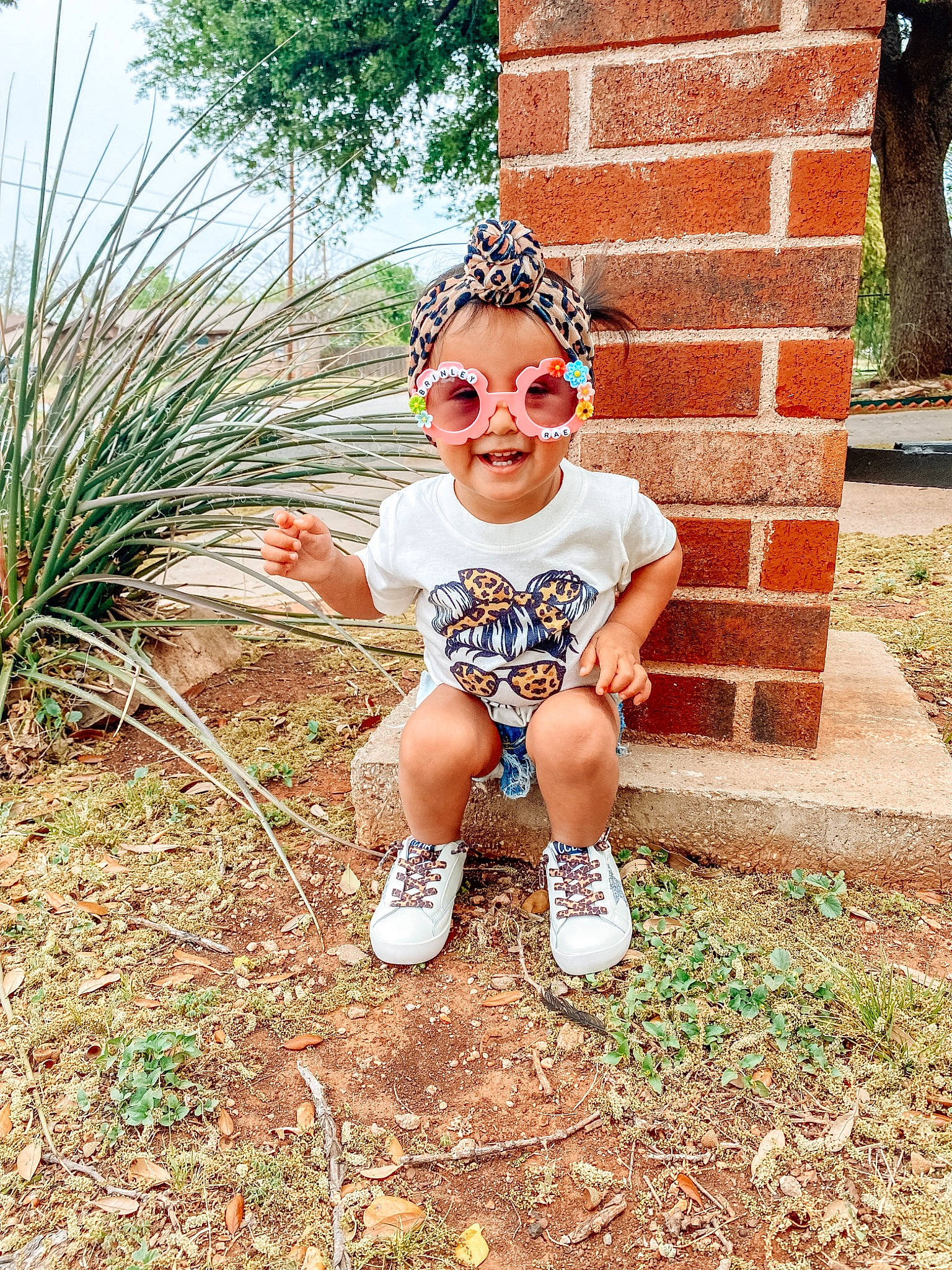 Brinley Rae joined the competition — help win amazing prizes! baby_toddler_clothing, electric_blue, eyewear, fun, goggles, grass, grass_family, happy, landscape, leaf, leisure, people_in_nature, person, plant, recreation, sitting, smile, soil, sunglasses, toddler