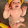 baby, child, diaper, helmet, yellow, toy, floor, wooden_floor, sitting, happy, face, hands, cute, indoor, infant, playtime, smiling, chubby, skin, expression