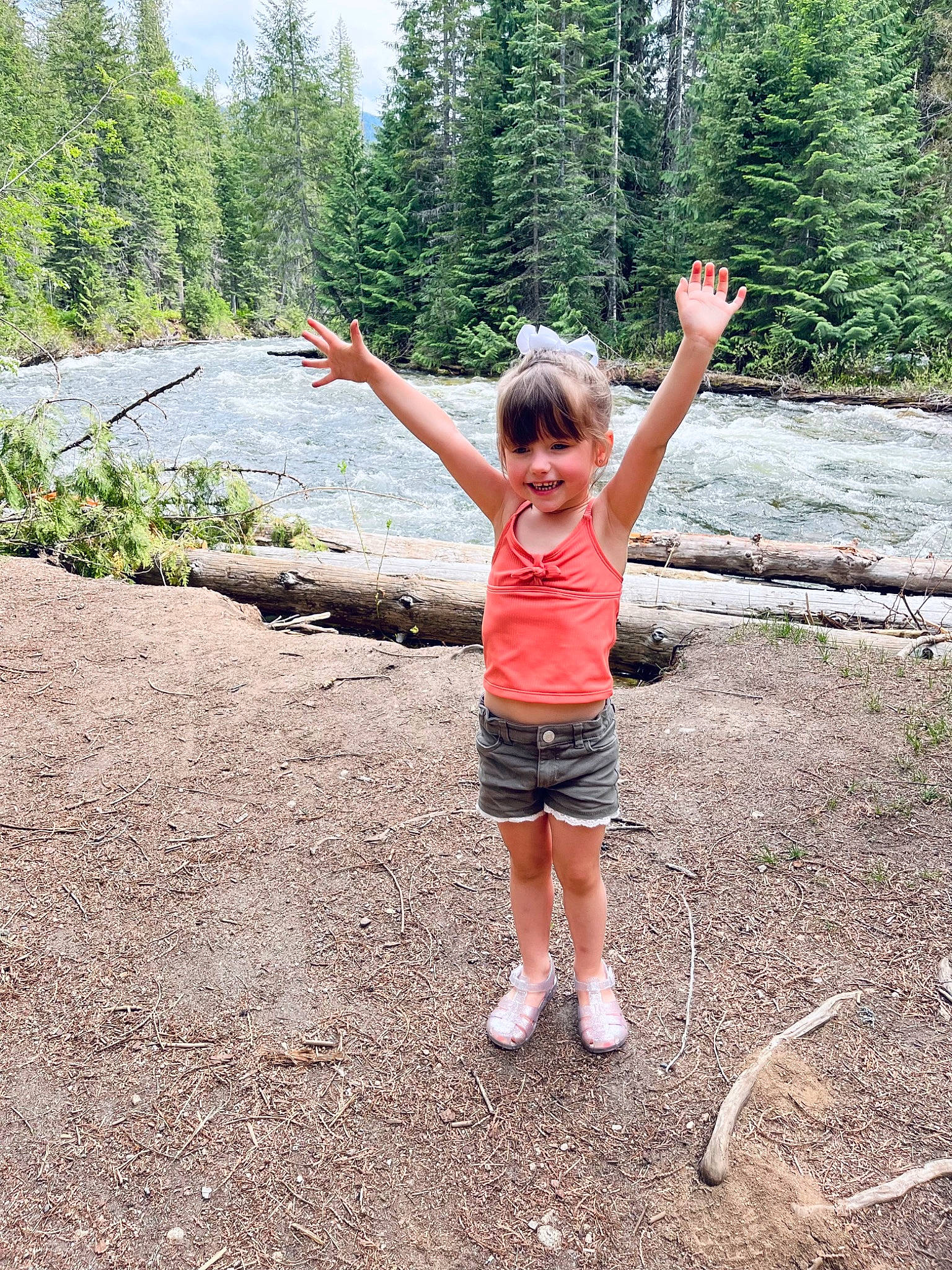 Penelope is registered to the contest to win money with this photo: adventure, balance, forest, fun, gesture, grass, happy, joy, landscape, leisure, natural_landscape, people_in_nature, person, plant, recreation, shorts, sky, smile, toddler, trail