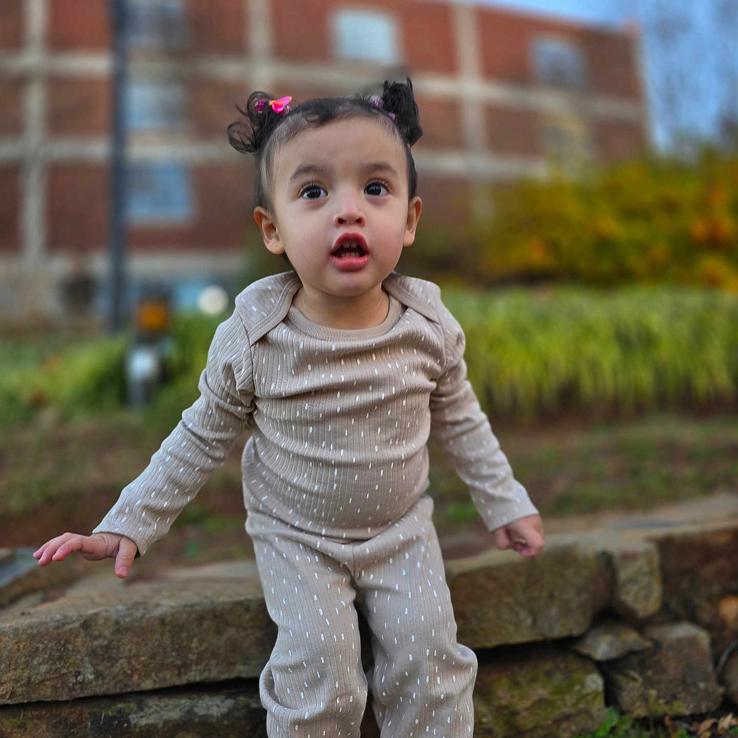 Luna is registered to the contest to win money with this photo: bodypart, child, clothing, face, female, finger, formalwear, girl, hand, head, knitwear, longsleeve, pants, path, person, photography, portrait, sleeve, sweater, walkway