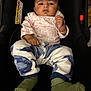 Dhriti participe au concours pour gagner de l'argent avec cette photo : baby, child, car_seat, clothing, pink, blue, green_socks, infant, portrait, indoor, person, cute, face, sitting, apparel, young_child, looking_at_camera, comfortable, casual, seat