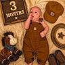 Henry is registered to the contest to win money with this photo: baby, infant, 3_months, brown_overalls, cowboy_hat, plush_horse, rope, star, cowboy_boots, blanket, lying_down, cute, child, indoors, soft_texture, portrait, props, resting, hand_on_face, baby_photography